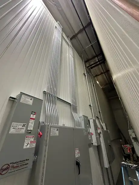 Open fusible service disconnect with sized phase conductors landed on lugs